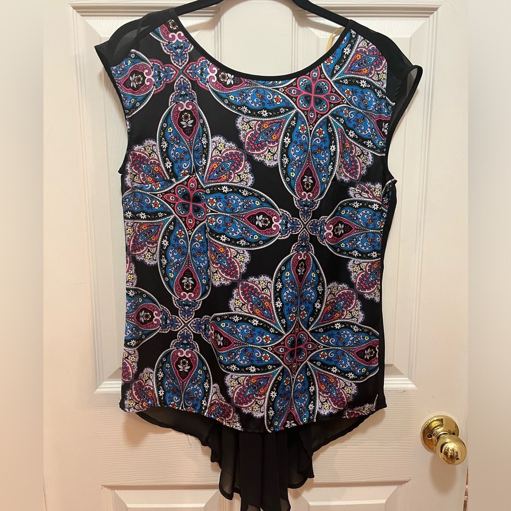 Shear back sleeveless blouse.